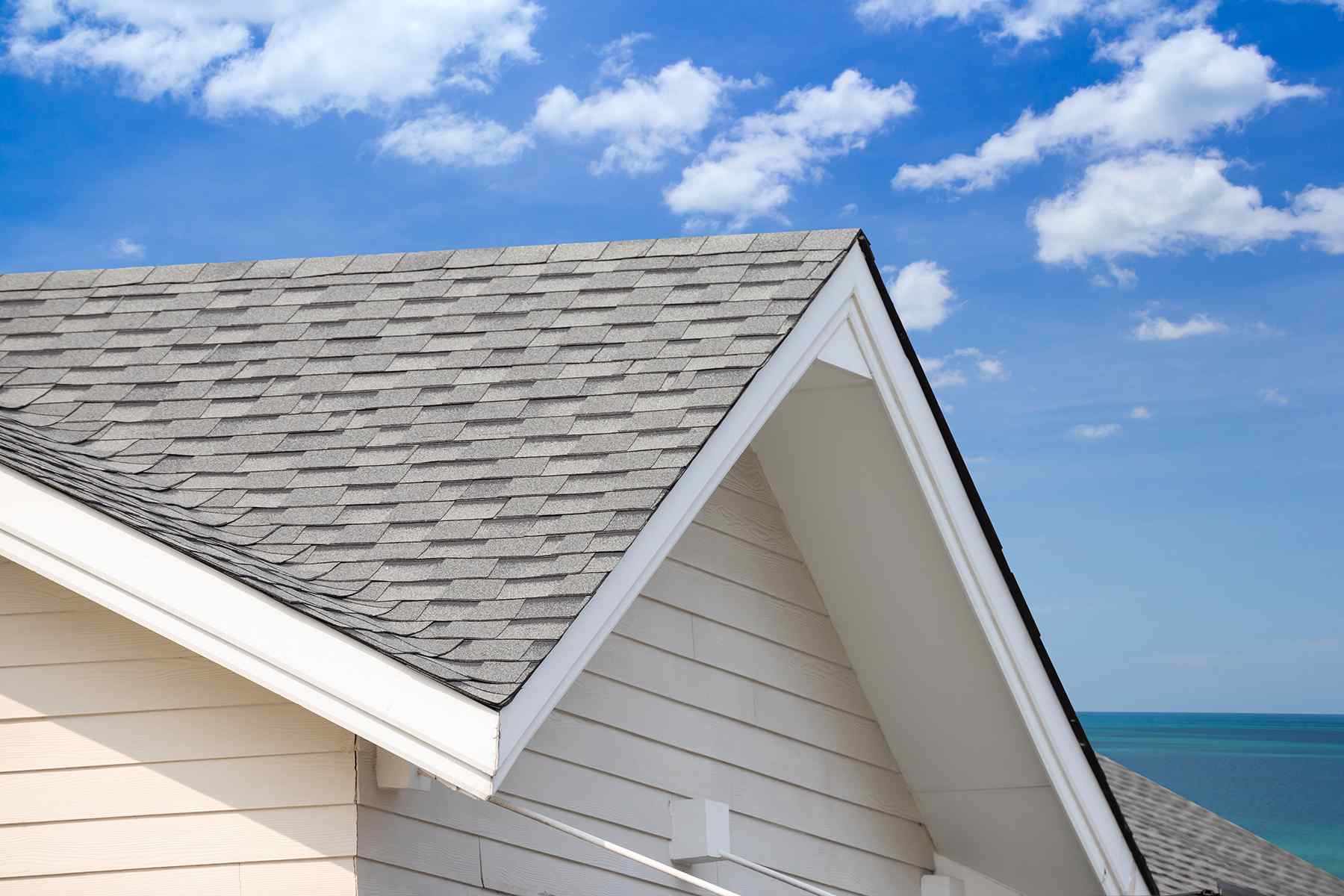 Newly installed gray asphalt shingle roof on a home in Newoport Beach, California