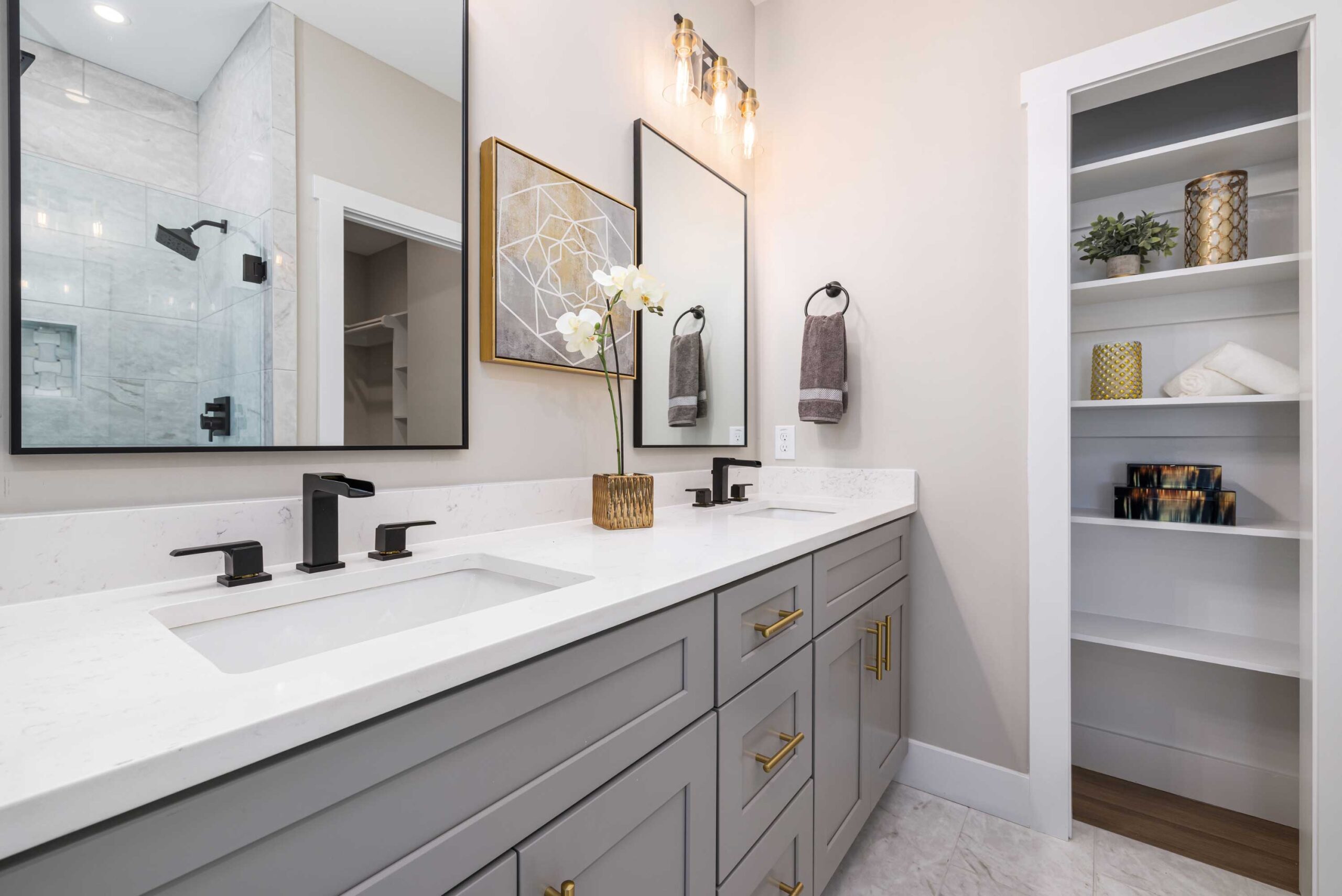 Modern bathroom remodel with built-in shelving and personalized décor in Orange County