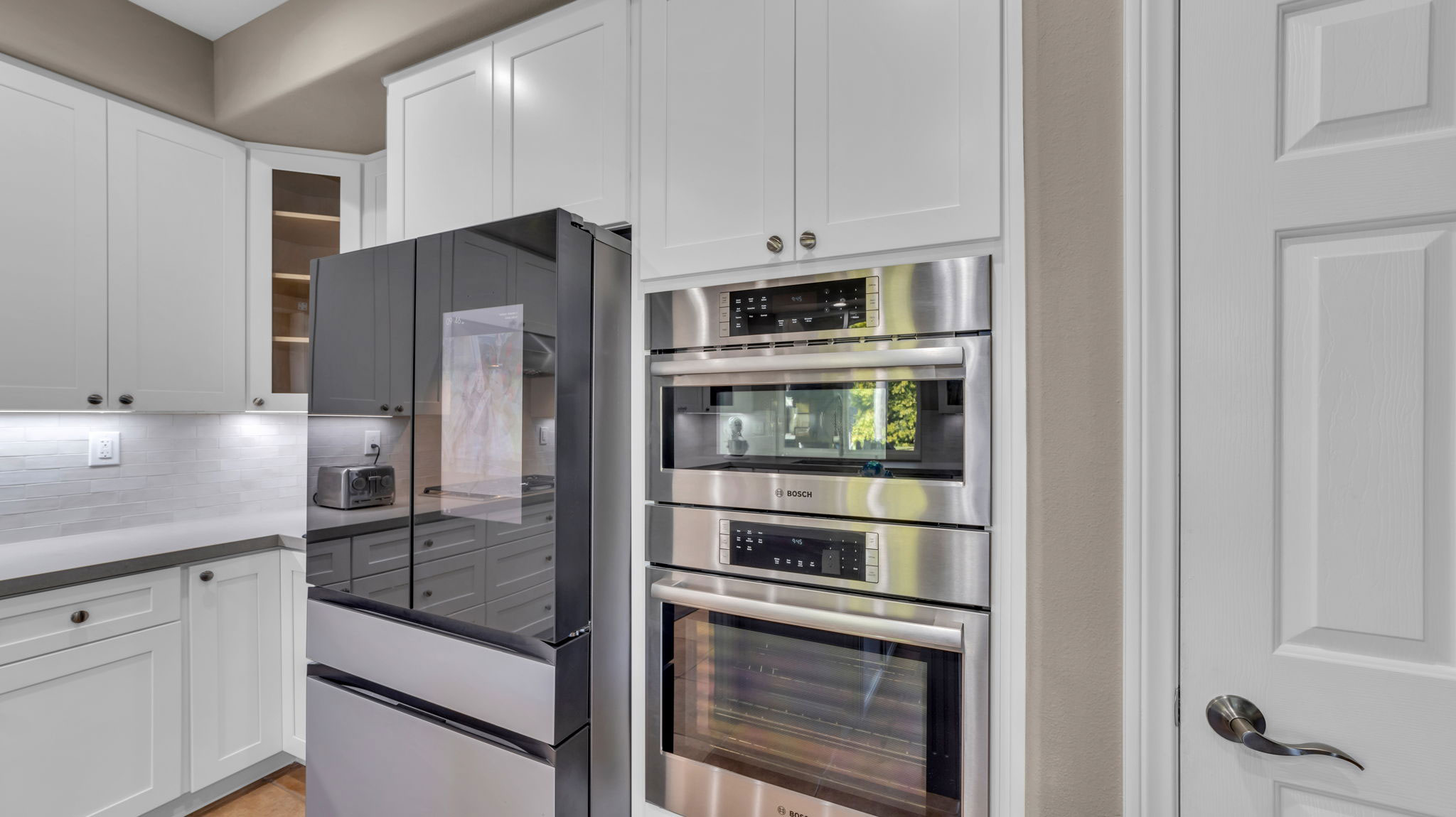 Modern kitchen with smart appliances and double ovens