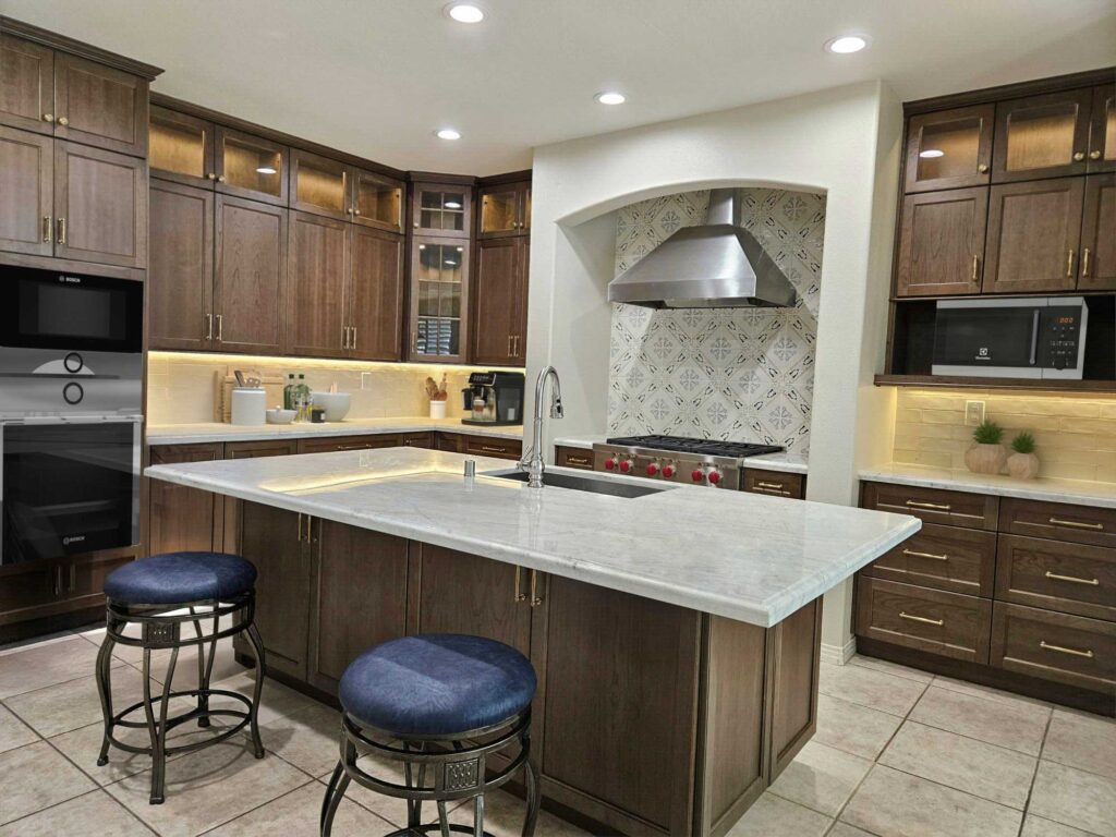 LED recessed and under-cabinet lighting in Costa Mesa kitchen remodel with energy-efficient smart lighting design.