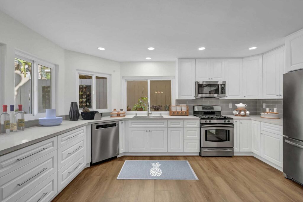 Santa Ana kitchen remodel with white cabinets and quartz counters – wide view