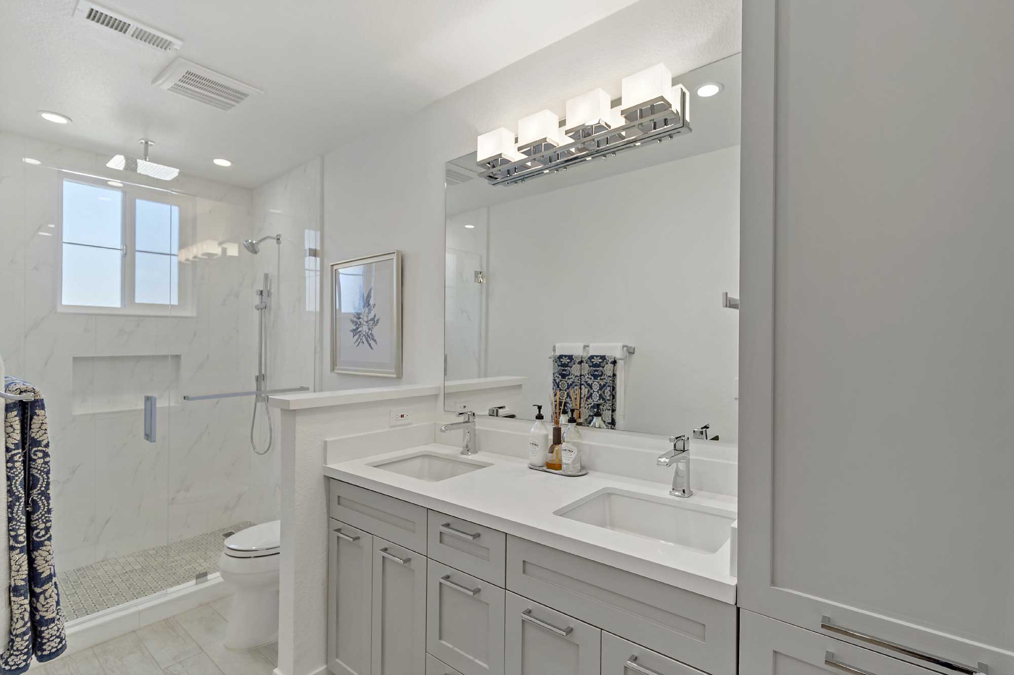 Anaheim– bathroom remodel with walk in shower and a dual vanity