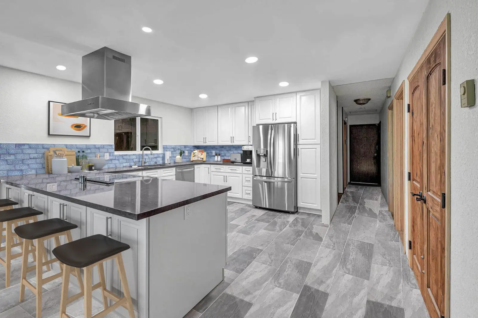 Laguna Hills kitchen remodel - White cabinets, blue backsplash, gray quartz island with bar seating