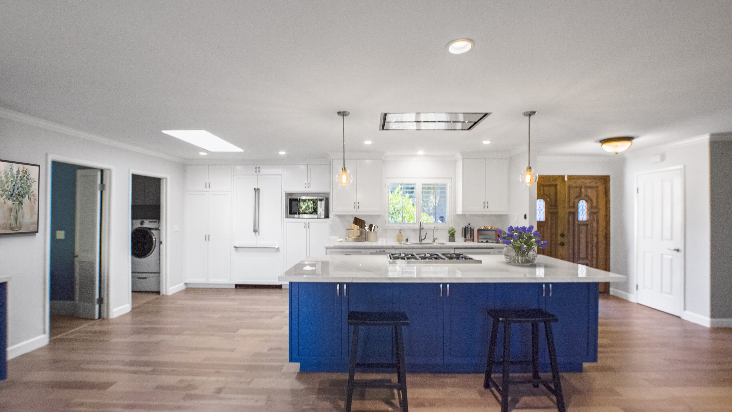 Laguna Niguel kitchen remodel with bold blue island, white shaker cabinets, quartz countertops, and hardwood floors by USA Home Remodeling