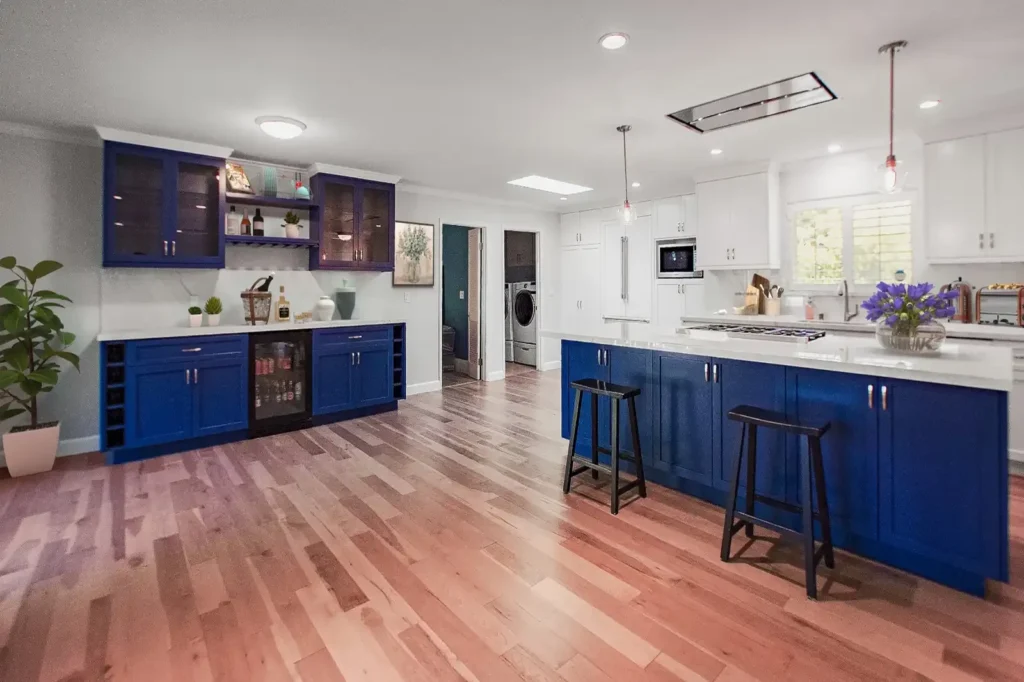Laguna Hills kitchen remodel - Bold blue cabinets, blue island, hardwood floors, wine storage, open layout