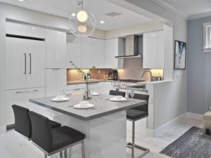 Mission Viejo kitchen remodel with luxe white finishes and quartz peninsula
