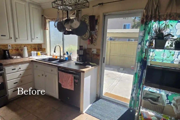 Original kitchen before a complete home remodel in Irvine with white cabinets, laminate counters, tile flooring, and a patio door.