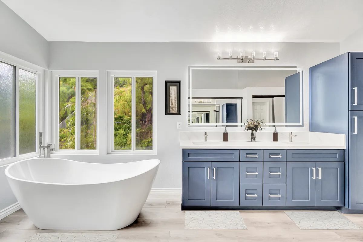 Yorba Linda master bathroom remodel — a dramatic Calacatta marble shower beside a freestanding tub