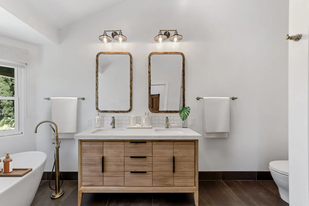 Laguna Woods master bathroom remodel — a light wood double vanity with brushed nickel fixtures