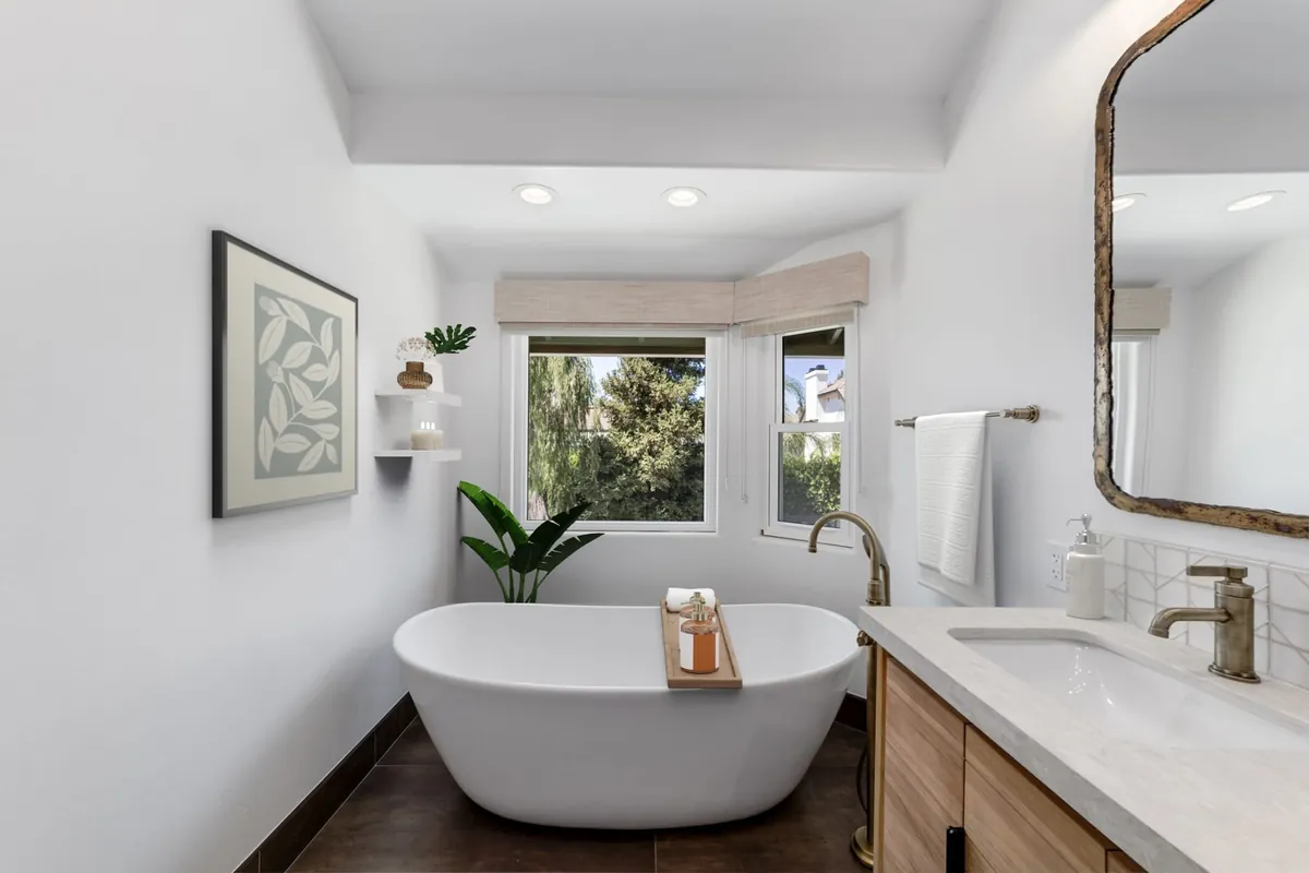 Lake Forest master bathroom remodel — a Scandinavian-style freestanding tub and light wood vanity