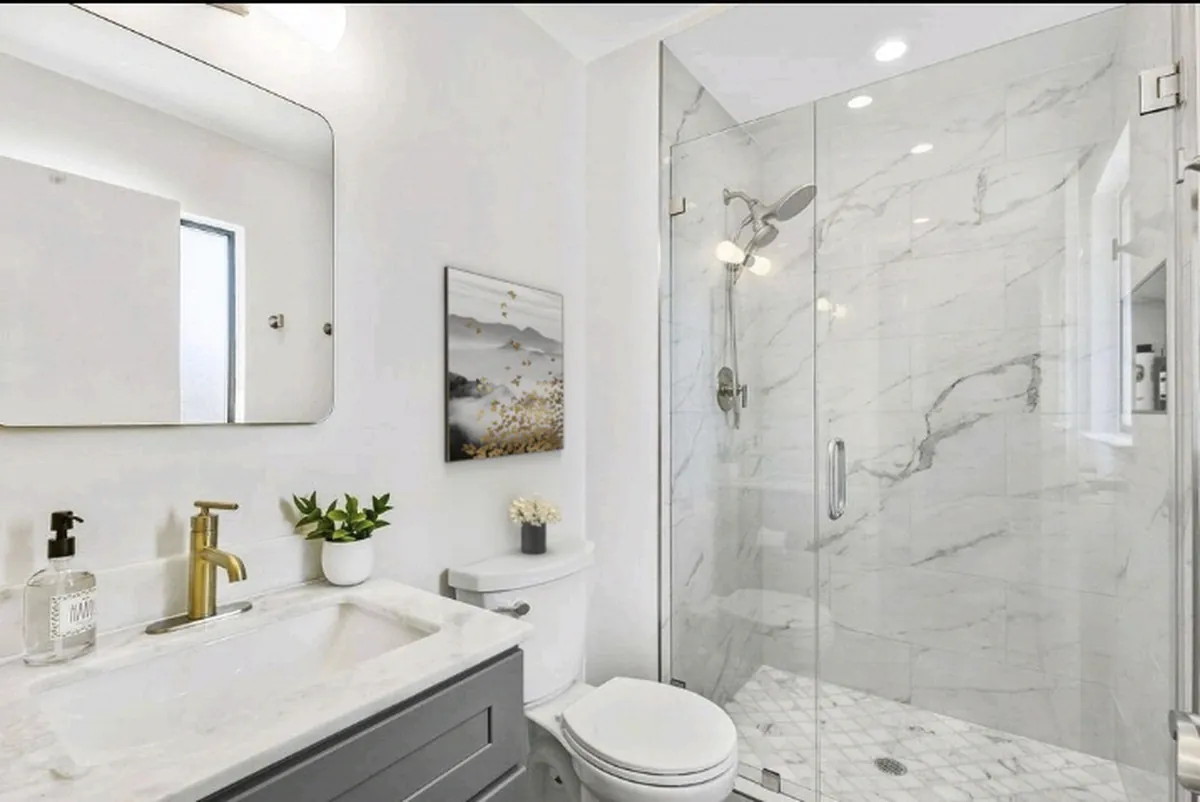 Brea guest bathroom remodeling project — a luxury guest bath with marble shower and designer fixtures