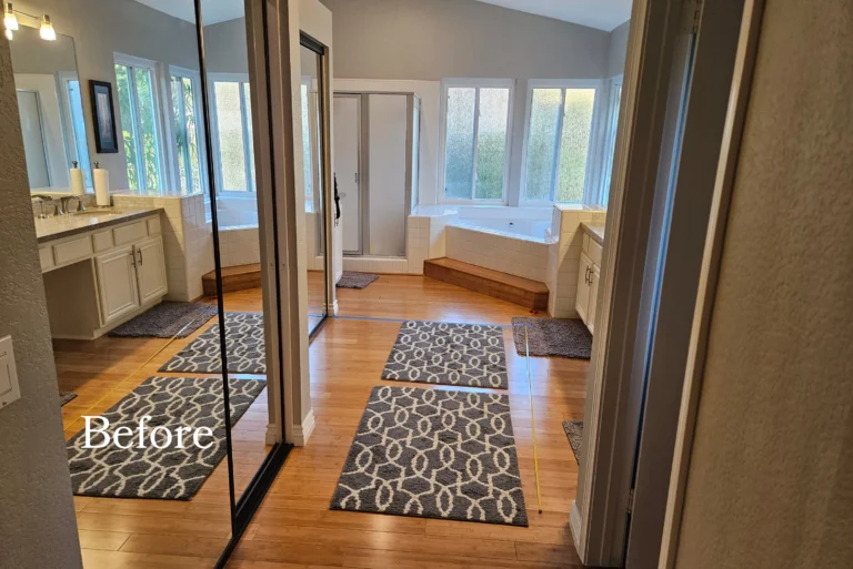 Original shower enclosure and dated vanity in a Laguna Hills primary bathroom before remodeling.