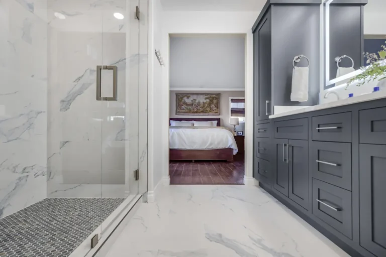 Marble-look porcelain tile floor running the length of a remodeled bathroom in Irvine, California