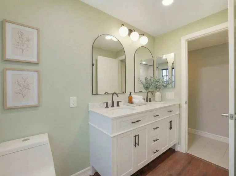 Irvine bathroom remodel with a white vanity, black fixtures, and subway tile accents for a minimalist and functional design.