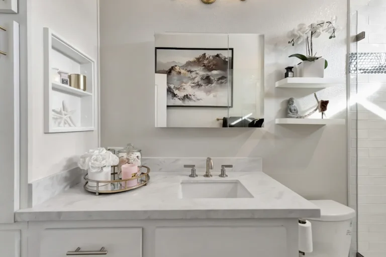 Undermount sink set in a marble-look quartz vanity top in a Newport Beach master bathroom