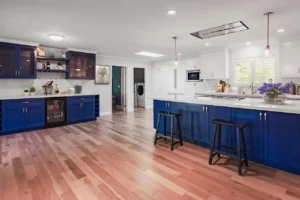 Laguna Niguel custom kitchen — blue island paint color and cabinet hardware close-up with hardwood floors.