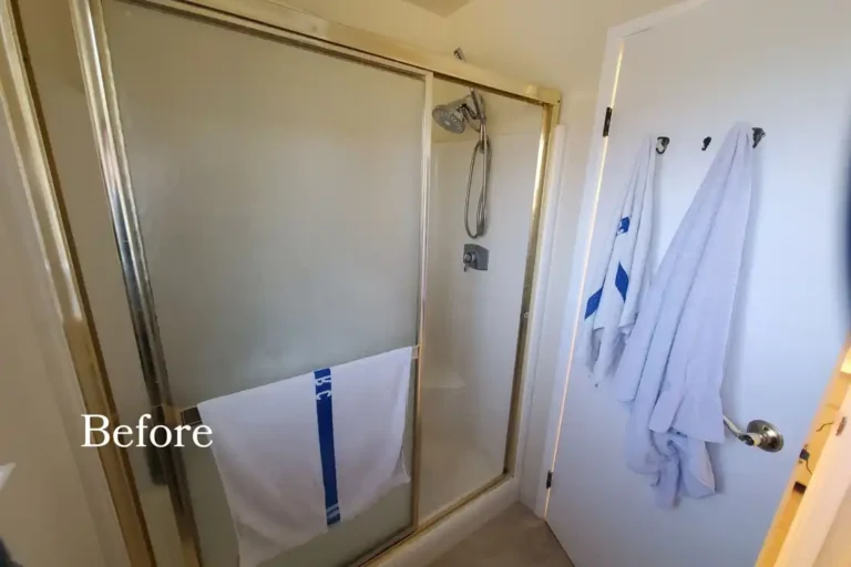 Original shower with gold framed sliding glass doors in an Aliso Viejo bathroom before remodeling.