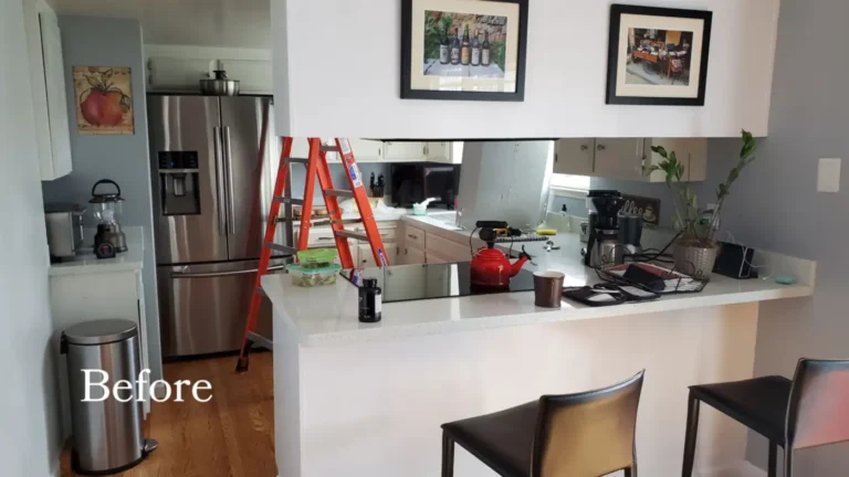 Before photo of the original Laguna Niguel kitchen with a speckled white counter peninsula and older off-white cabinets