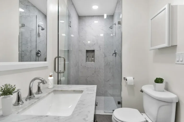 Narrow Irvine bathroom remodel with a marble tile walk-in shower and a long vanity with marble countertop