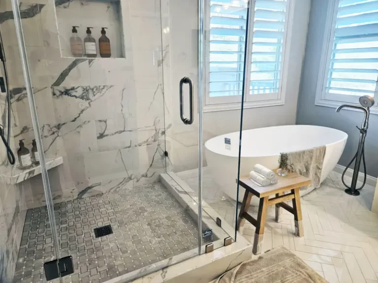 Ladera Ranch shower and tub with marble‑look tile and stool