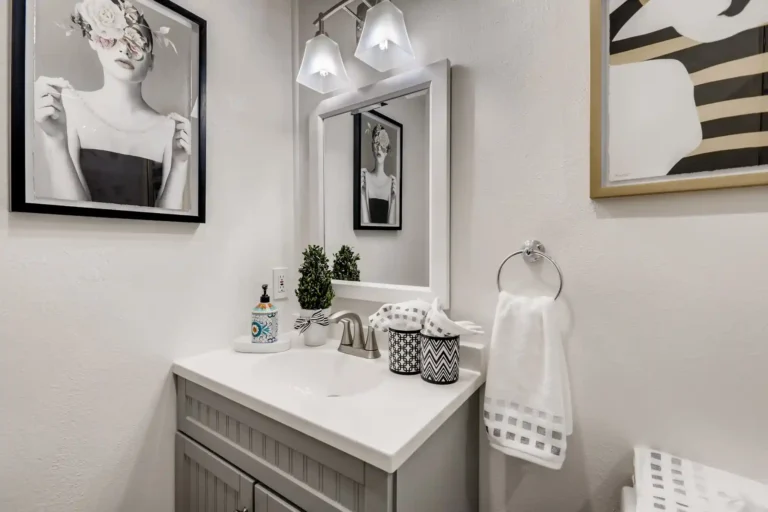 Close view of the integrated sink and brushed nickel faucet on the new vanity in a San Clemente guest bathroom