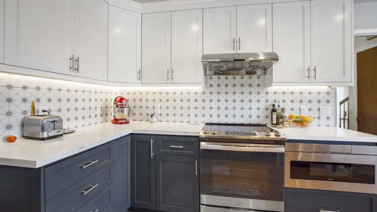 Star pattern tile backsplash with under cabinet lights above a slide-in range in a Laguna Niguel kitchen remodel