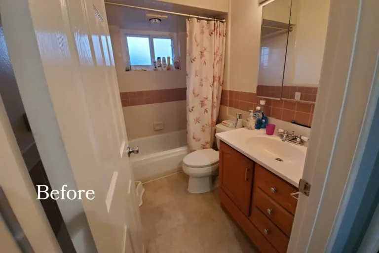 Before photo of a dated Lake Forest bathroom with pink wall tile, an oak vanity, and a floral shower curtain.