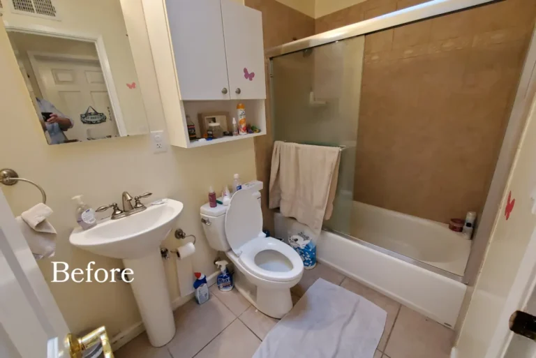 Before photo of a dated Irvine bathroom with a pedestal sink, beige tile, and sliding glass tub doors.