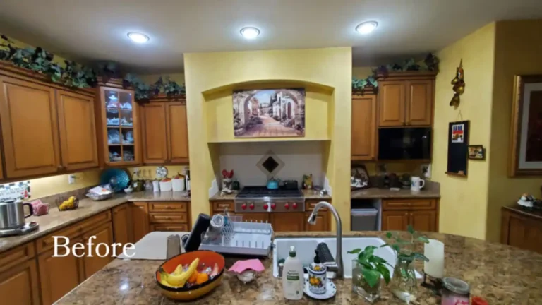 Before remodeling, a Costa Mesa kitchen with honey oak cabinets, granite countertops, and yellow walls around the range