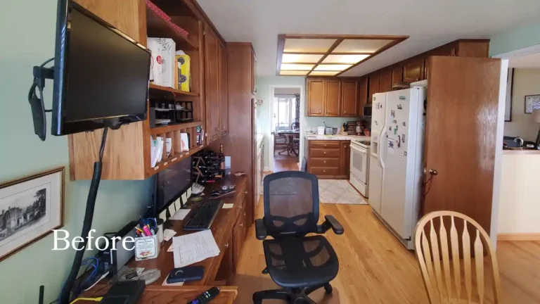 Before photo of a Laguna Niguel galley kitchen with oak cabinets, tiled counters, a built-in desk, and a white fridge