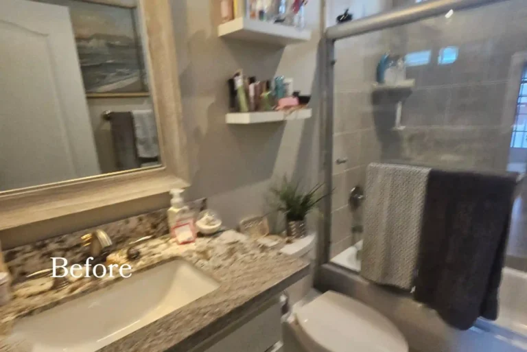 Before photo of the dated granite vanity and framed sliding shower doors in a Newport Beach guest bathroom