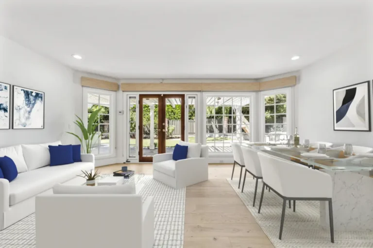 Bright Santa Ana living room with wide-plank wood floors, French doors to the patio, recessed lights, and dining area.
